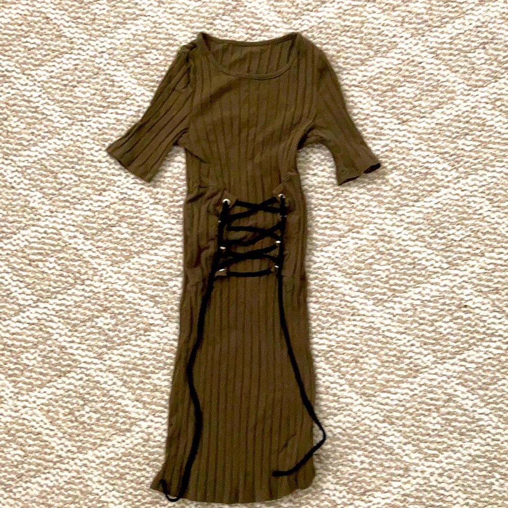 Green corseted looking dress cinching the waist.